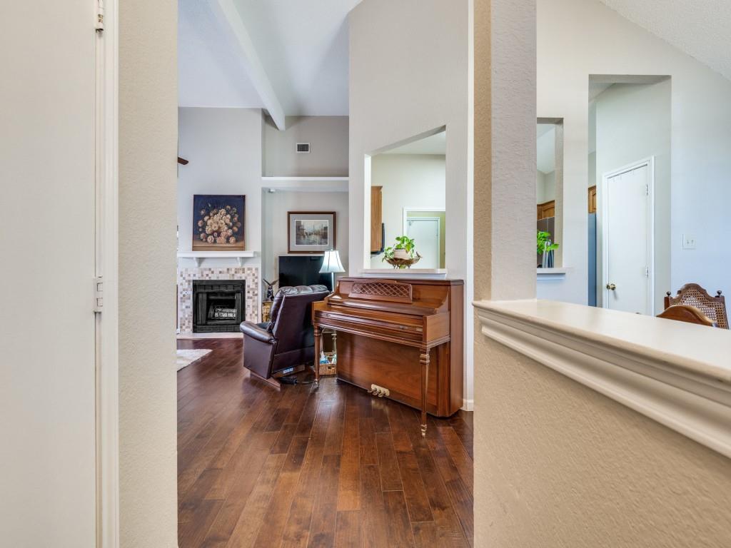 4321 Harvest Hill Road Carrollton, TX 75010 - Photo 11 of 25 a living room with furniture and a fireplace