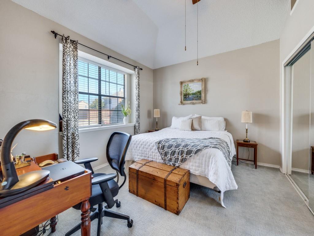 4321 Harvest Hill Road Carrollton, TX 75010 - Photo 12 of 25 a bedroom with a bed a desk and chair with windows
