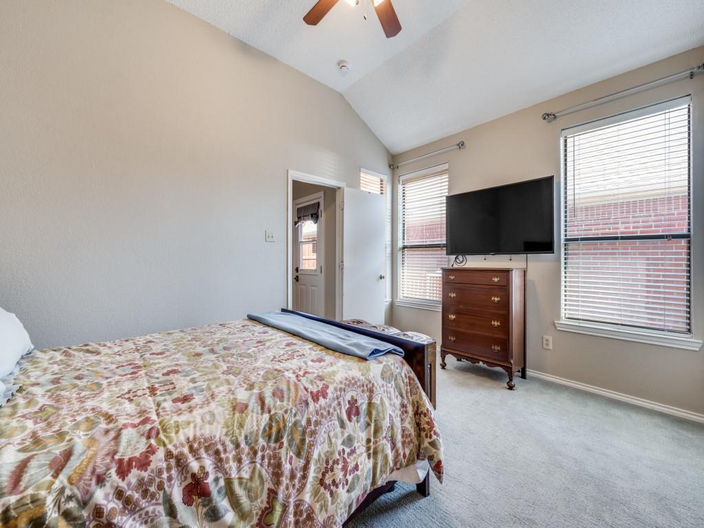 4321 Harvest Hill Road Carrollton, TX 75010 - Photo 17 of 25 a bedroom with a bed and a flat screen tv