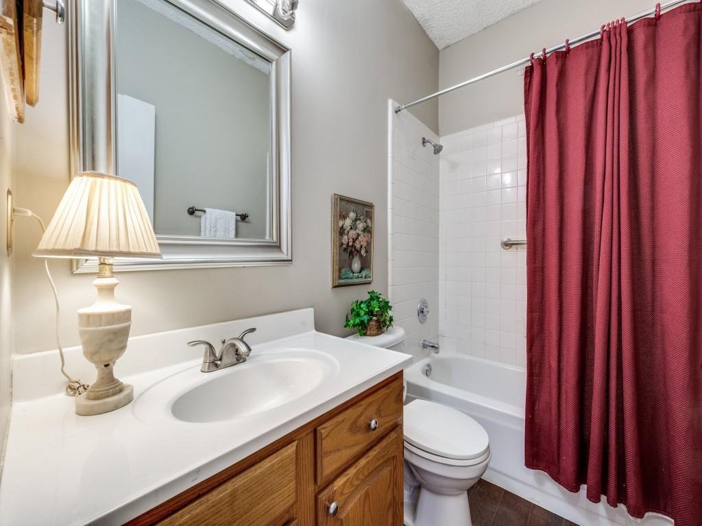 4321 Harvest Hill Road Carrollton, TX 75010 - Photo 20 of 25 a bathroom with a sink toilet and shower