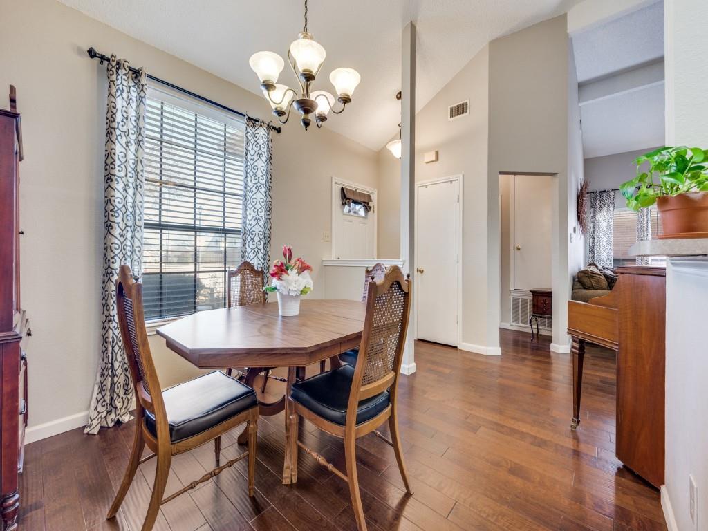 4321 Harvest Hill Road Carrollton, TX 75010 - Photo 6 of 25 a view of a dining room with furniture wooden floor and chandelier