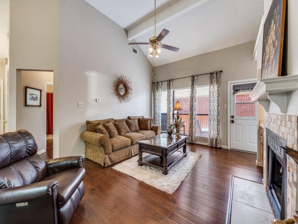 4321 Harvest Hill Road Carrollton, TX 75010 - Photo 8 of 25 a living room with furniture and a fireplace