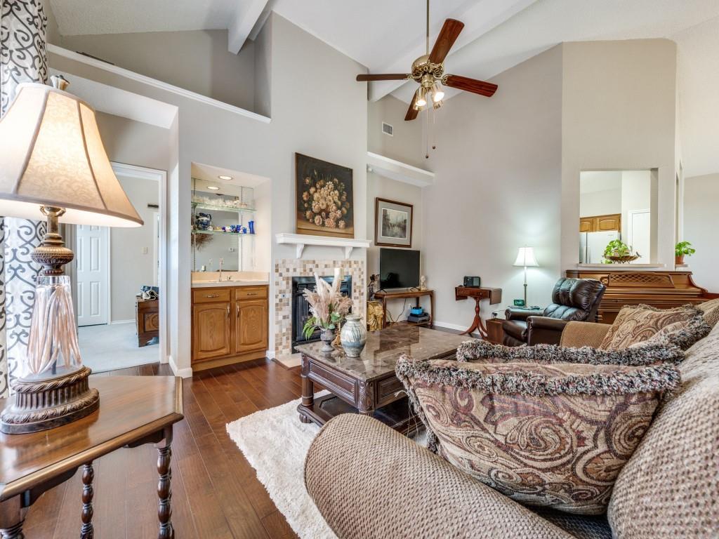 4321 Harvest Hill Road Carrollton, TX 75010 - Photo 10 of 25 a living room with fireplace furniture and a flat screen tv