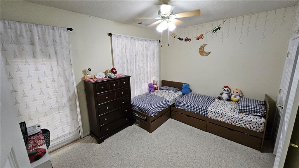 112 Camry Lane Southwest Grayson, GA 30017 - Photo 12 of 15 a living room with furniture flowerpot and window