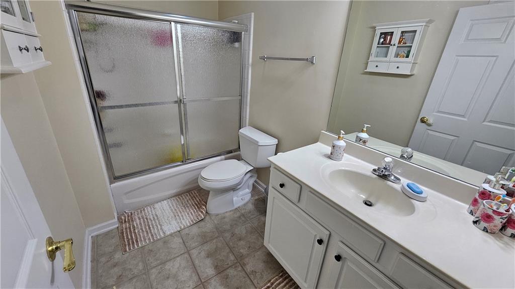 112 Camry Lane Southwest Grayson, GA 30017 - Photo 13 of 15 a bathroom with a sink and a mirror