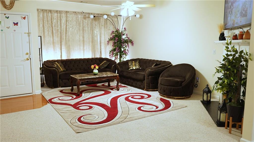 112 Camry Lane Southwest Grayson, GA 30017 - Photo 4 of 15 a living room with furniture and a potted plant