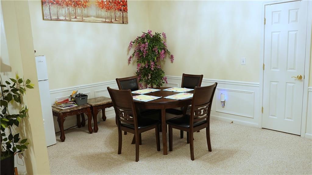 112 Camry Lane Southwest Grayson, GA 30017 - Photo 6 of 15 a view of a dining room with furniture and wooden floor