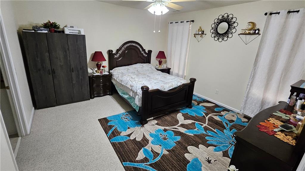 112 Camry Lane Southwest Grayson, GA 30017 - Photo 9 of 15 a bedroom with a bed and dresser