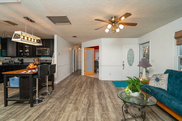 a man sitting on a bench in front of a building