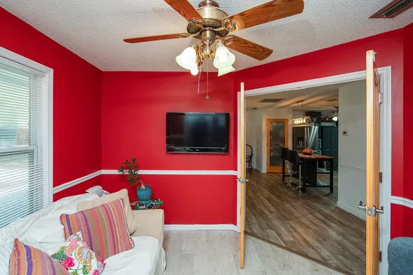 a backyard of a house with barbeque oven table and chairs