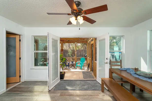 a view of a dining room with furniture and wooden floor