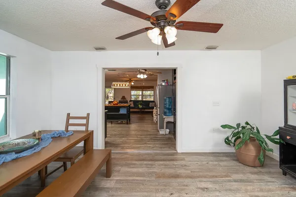 a view of a livingroom with furniture and a flat screen tv
