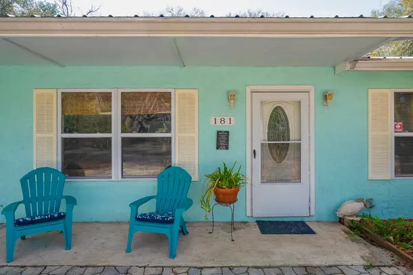 a bedroom with bed and wooden floor