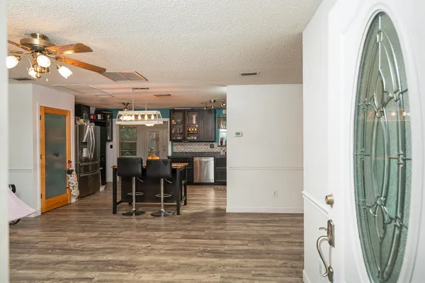 a view of a livingroom with furniture and a flat screen tv