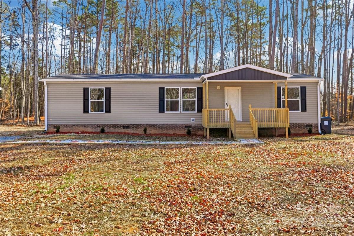 1381 Safrit Road Salisbury, NC 28146 - Photo 1 of 19 a front view of a house with garden