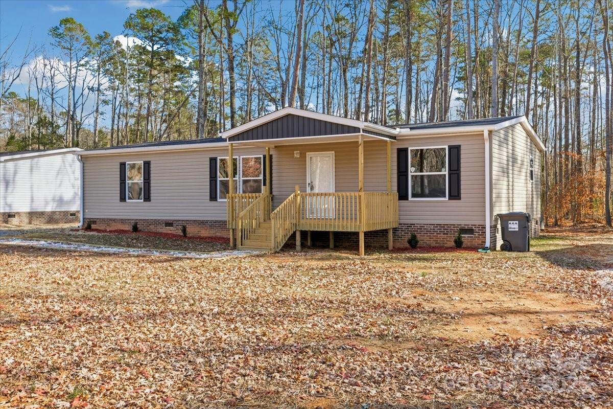 1381 Safrit Road Salisbury, NC 28146 - Photo 2 of 19 a front view of a house with a yard