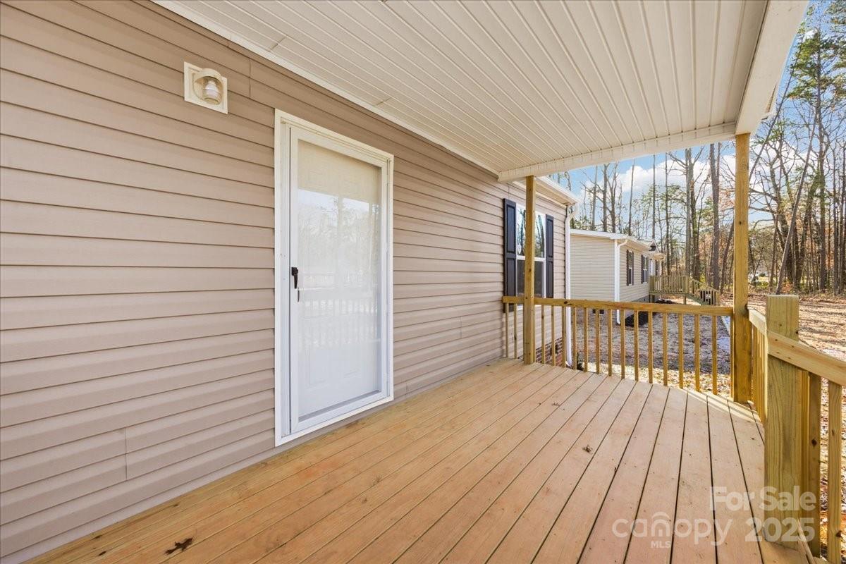 1381 Safrit Road Salisbury, NC 28146 - Photo 3 of 19 a view of a balcony with wooden floor