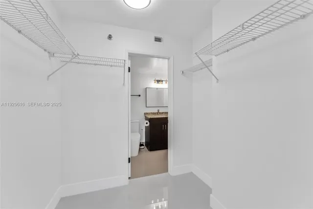 a bathroom with a shower and a toilet