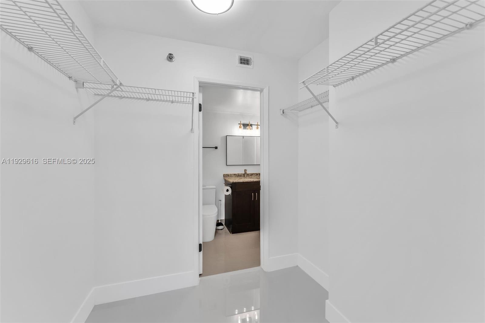 770 Claughton Island Drive, Unit 1401 Miami, FL 33131 - Photo 11 of 31 a bathroom with a shower and a toilet