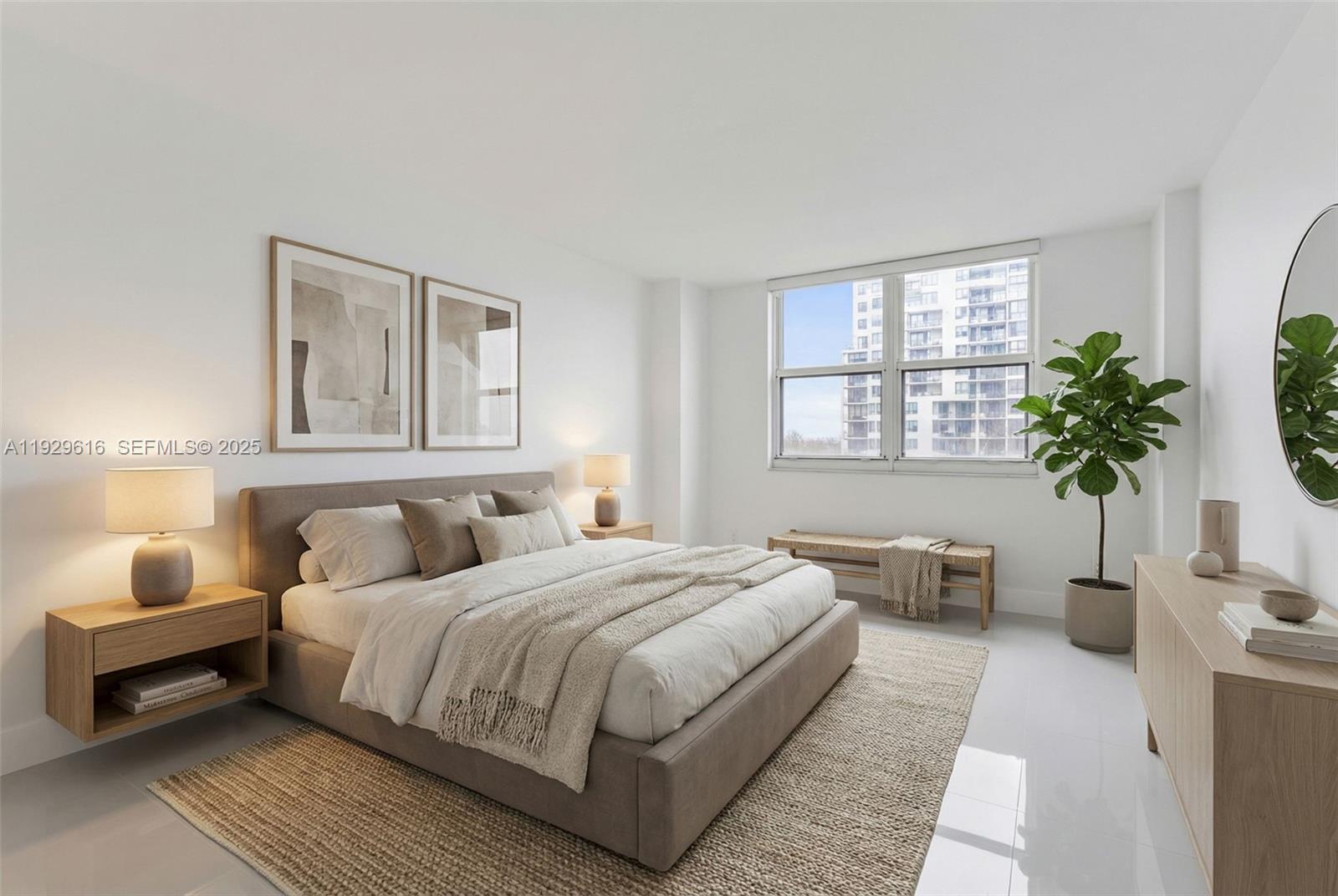 770 Claughton Island Drive, Unit 1401 Miami, FL 33131 - Photo 31 of 31 a bedroom with a large bed and a potted plant