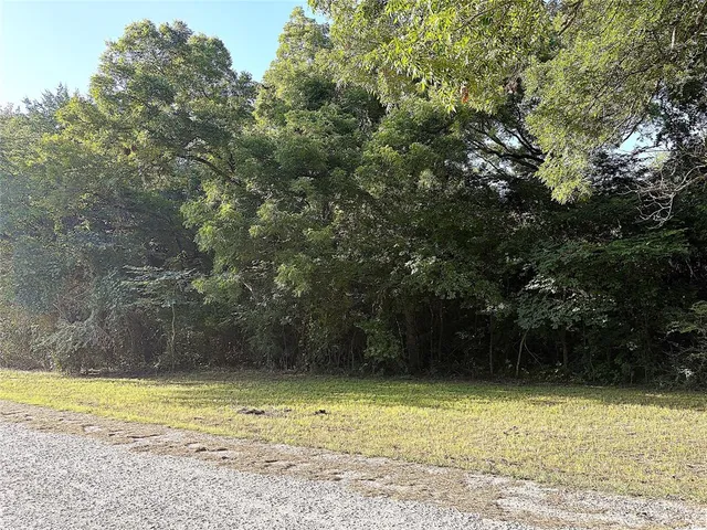 a view of a swimming pool with a yard