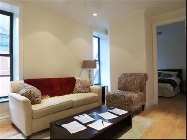 a living room with furniture and a window