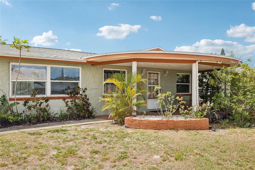 3548 Darlington Road Holiday, FL 34691 - Photo 2 of 32 a front view of a house with garden