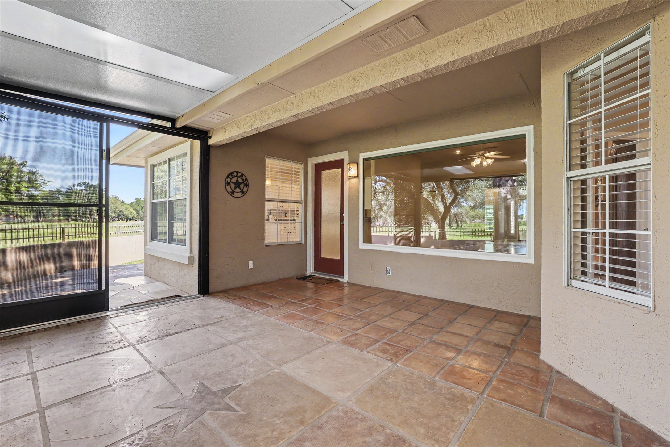 30107 Hamlet Circle Georgetown, TX 78628 - Photo 26 of 40 A spacious covered patio invites outdoor enjoyment with durable tile flooring and views of the surrounding landscape.