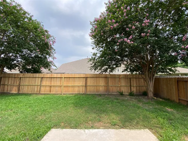 a view of a backyard with a garden