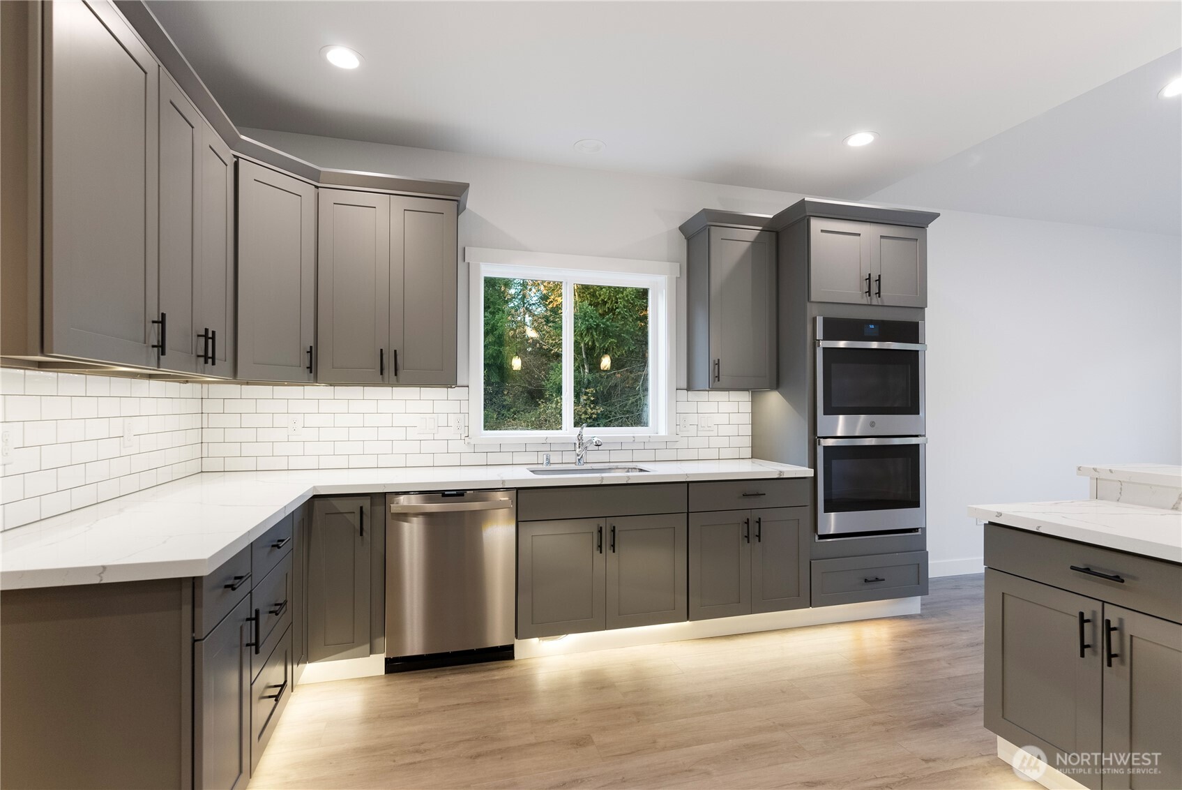 14443 Mima Road Southwest Olympia, WA 98512 - Photo 12 of 38 a kitchen with stainless steel appliances granite countertop a sink and stove top oven