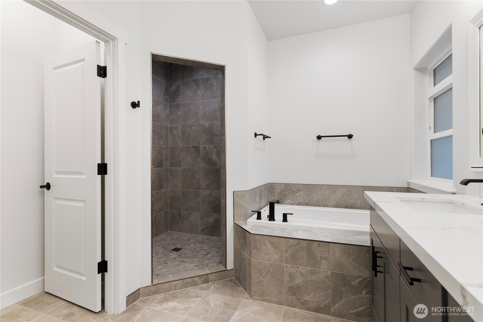 14443 Mima Road Southwest Olympia, WA 98512 - Photo 15 of 38 a bathroom with a tub sink and shower