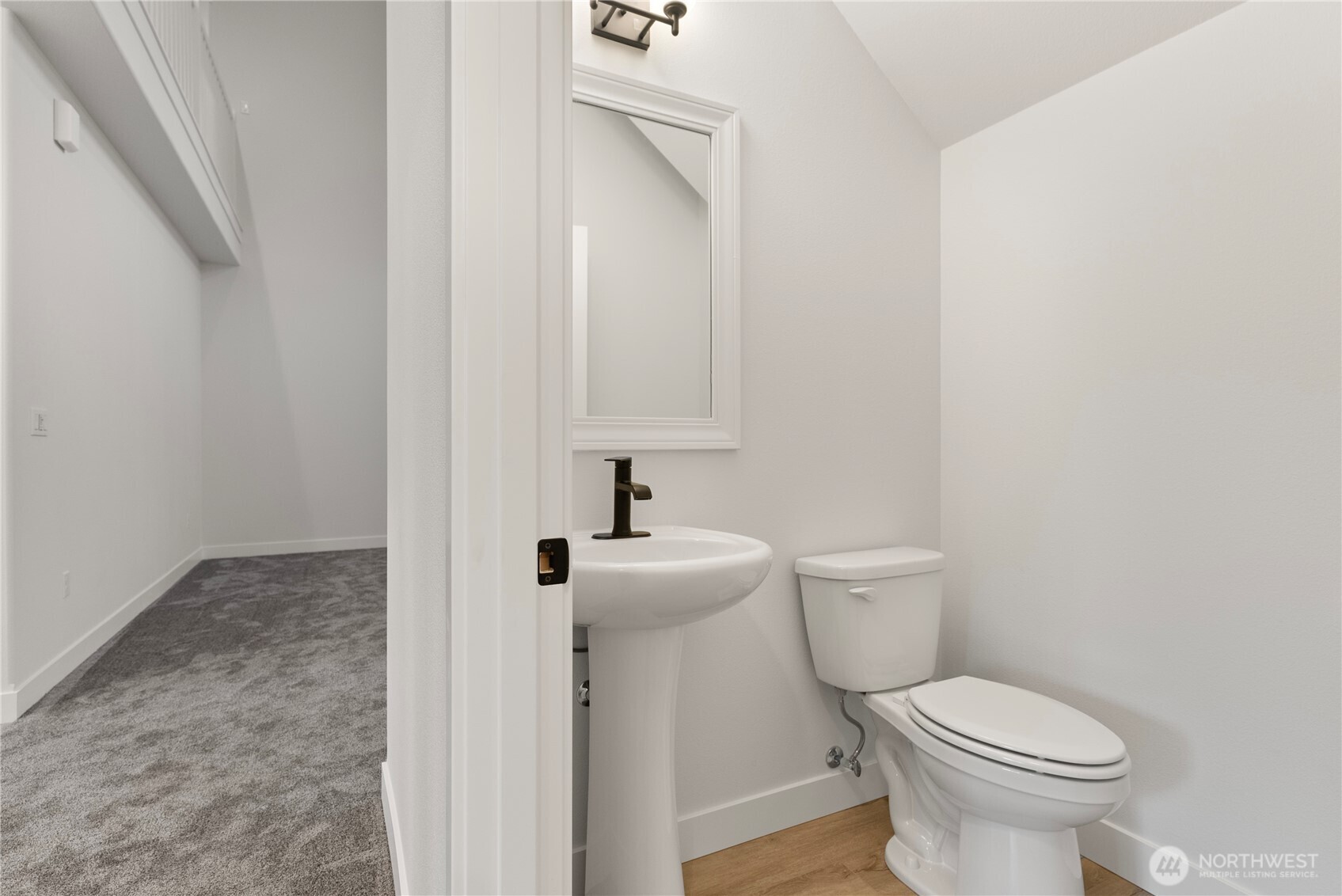 14443 Mima Road Southwest Olympia, WA 98512 - Photo 25 of 38 a white toilet sitting next to a white sink