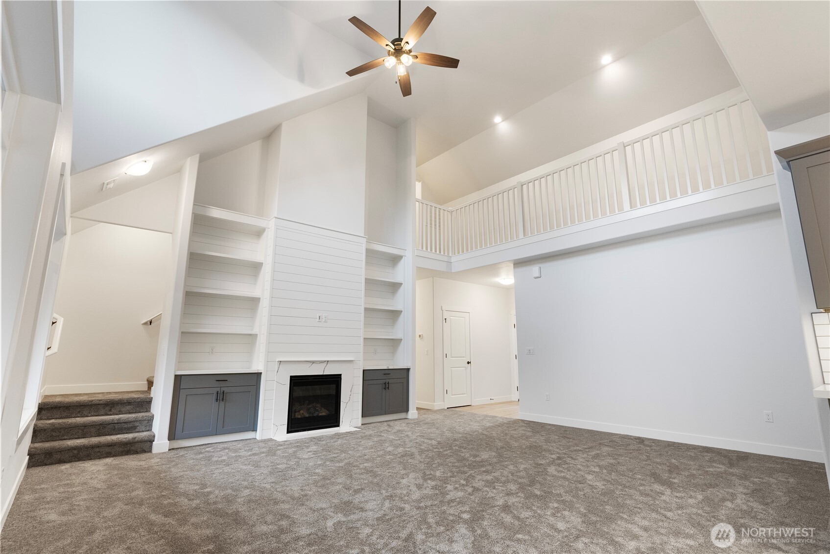 14443 Mima Road Southwest Olympia, WA 98512 - Photo 5 of 38 wooden floor in an empty room with a fireplace