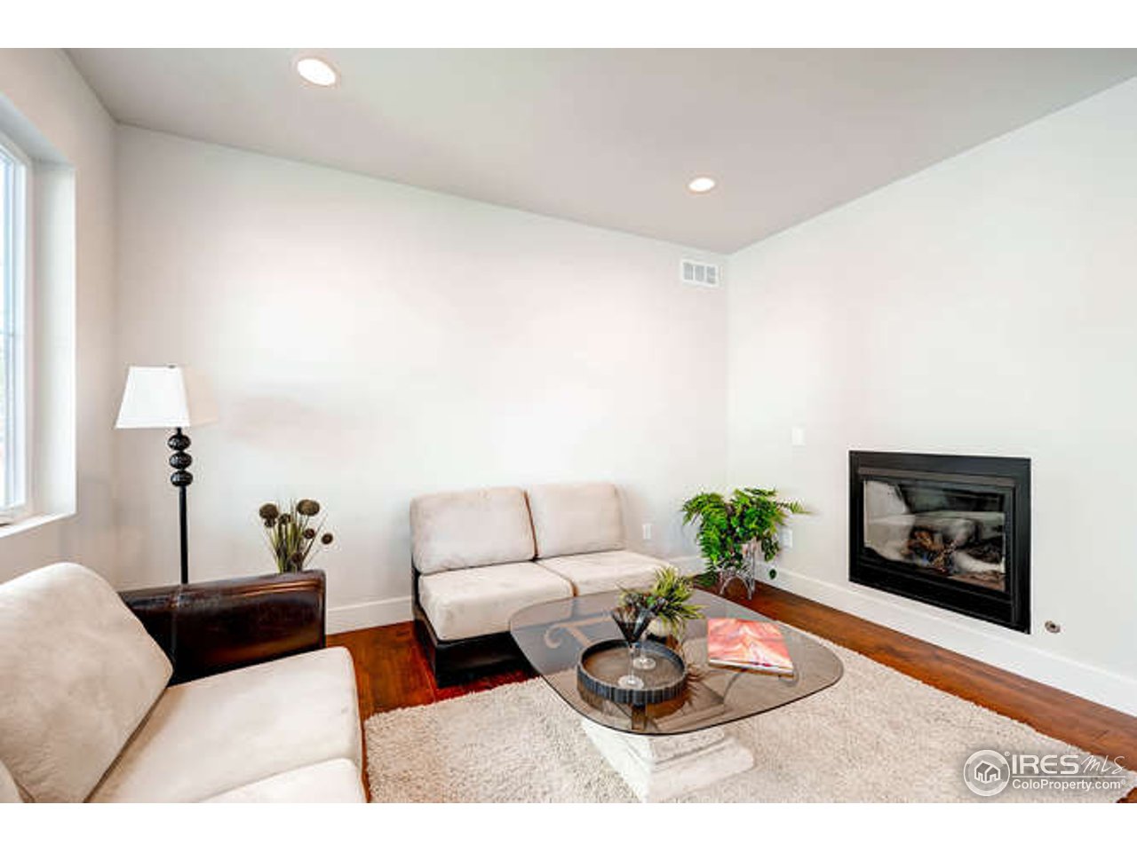 808 East Baseline Road, Unit B Lafayette, CO 80026 - Photo 6 of 9 a living room with furniture and a fireplace