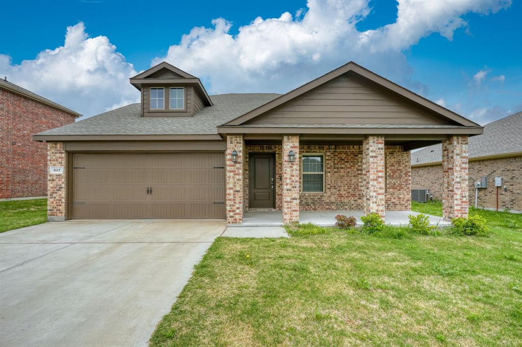 317 Sage Street Anna, TX 75409 - Photo 1 of 33 a front view of a house with a yard and garage