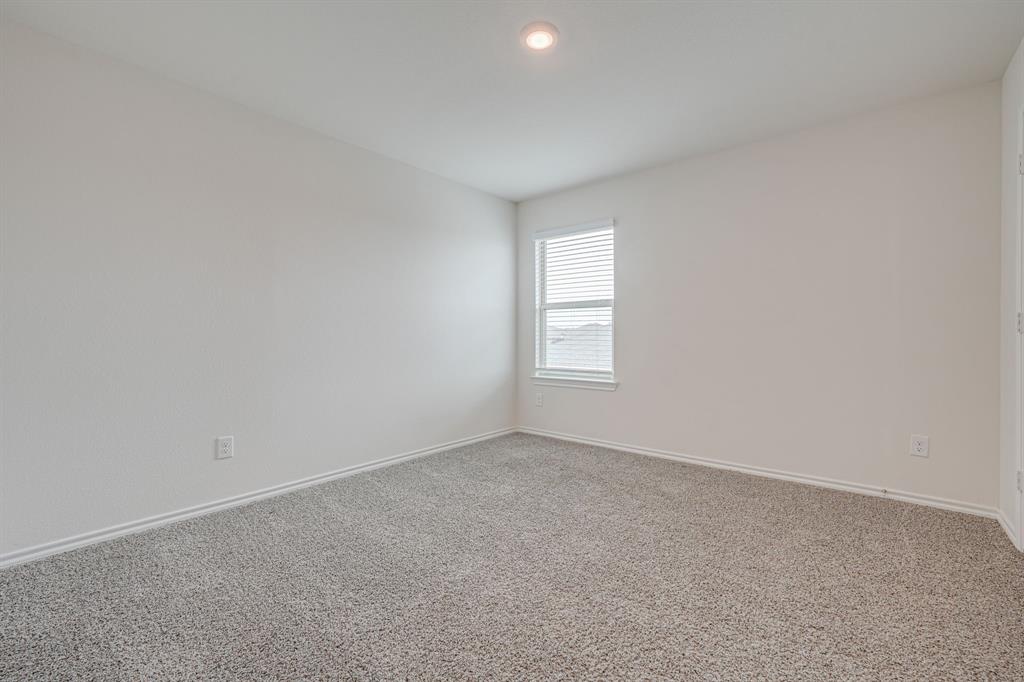 317 Sage Street Anna, TX 75409 - Photo 22 of 33 an empty room with windows