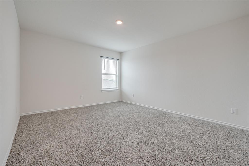 317 Sage Street Anna, TX 75409 - Photo 23 of 33 an empty room with windows