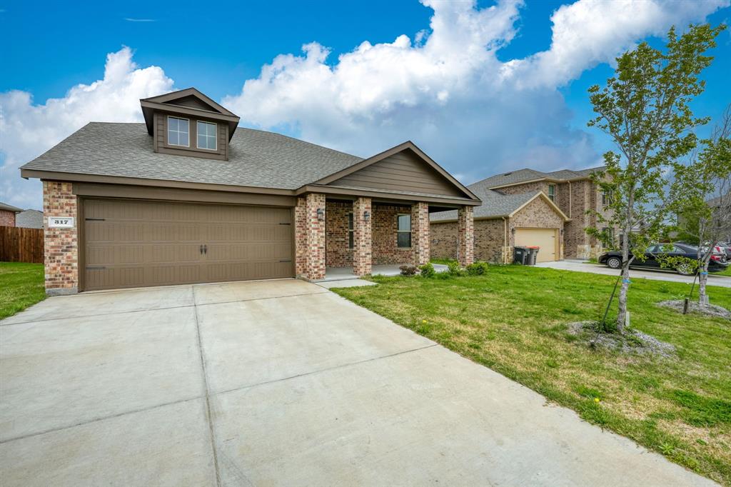 317 Sage Street Anna, TX 75409 - Photo 3 of 33 a front view of a house with yard