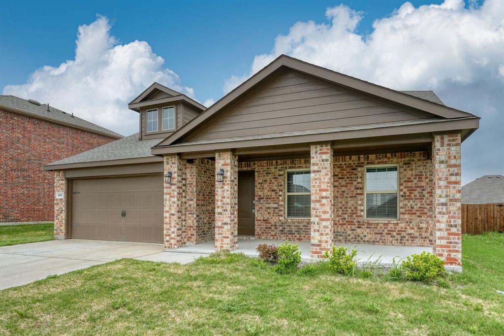 317 Sage Street Anna, TX 75409 - Photo 4 of 33 a front view of a house with a garden