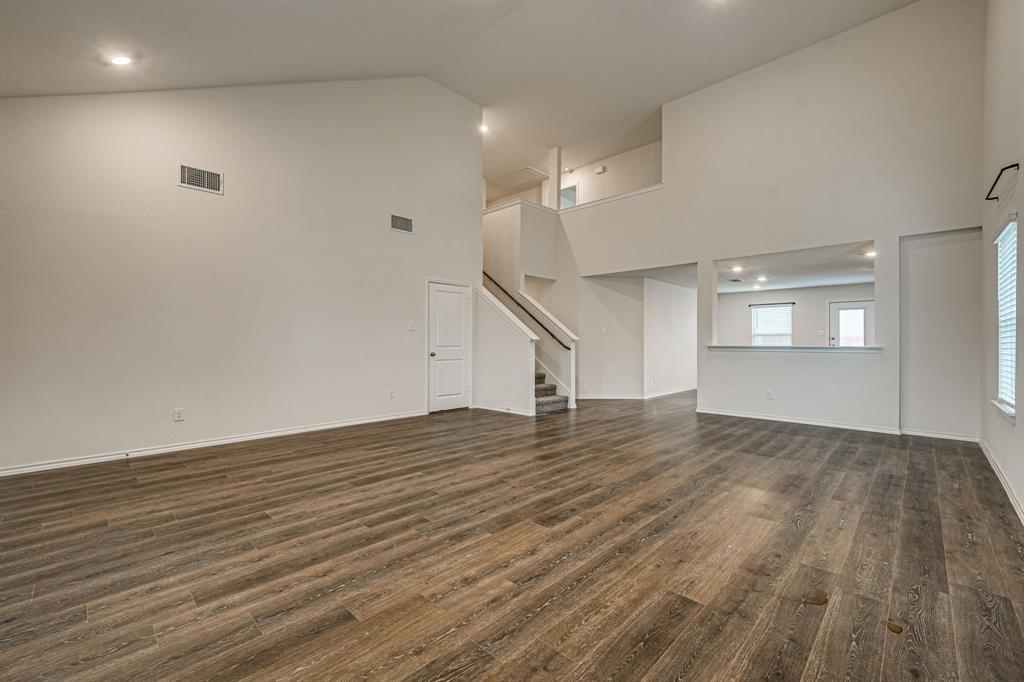 317 Sage Street Anna, TX 75409 - Photo 6 of 33 a view of empty room with wooden floor and fan
