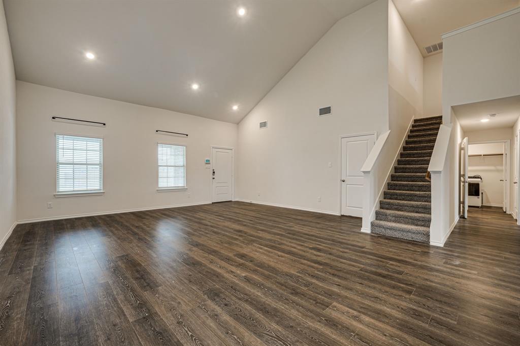 317 Sage Street Anna, TX 75409 - Photo 7 of 33 an empty room with wooden floor & windows