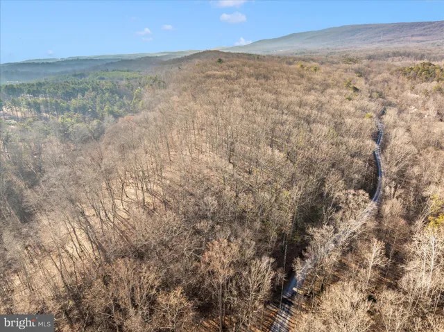 a view of ocean and a mountain