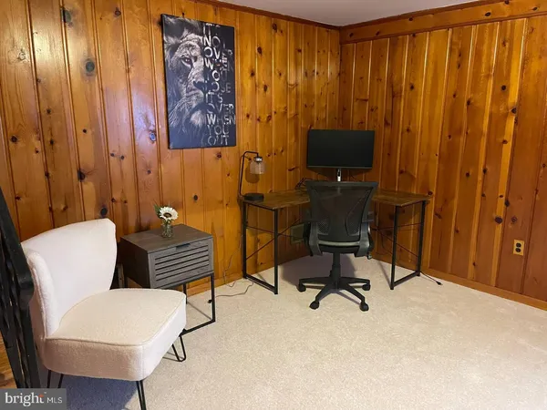 a view of workspace filled with furniture
