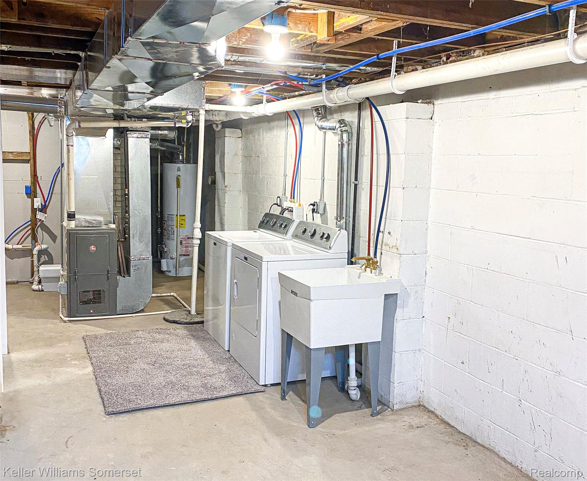 1821 Nazareth Road Kalamazoo, MI 49048 - Photo 19 of 20 Dedicated laundry area featuring a washer, dryer, and utility sink