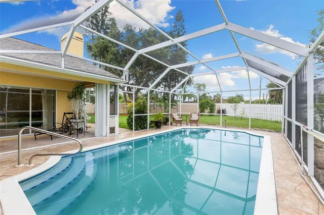 a view of swimming pool with seating area
