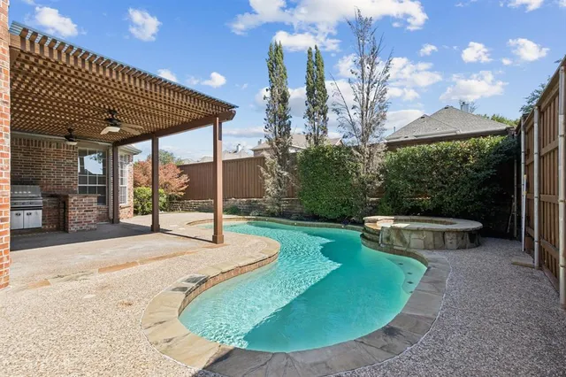 a living room with furniture and floor to ceiling windows