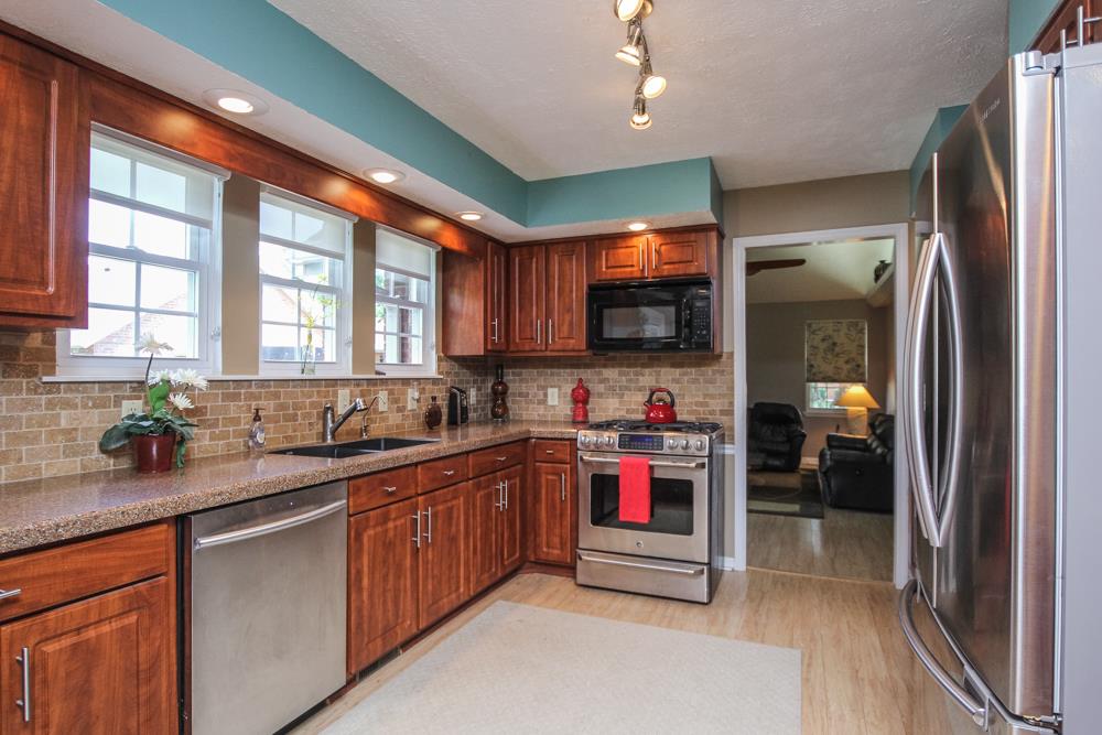 496 Horn Springs Road Lebanon, TN 37087 - Photo 14 of 30 a kitchen with stainless steel appliances granite countertop a refrigerator and a sink