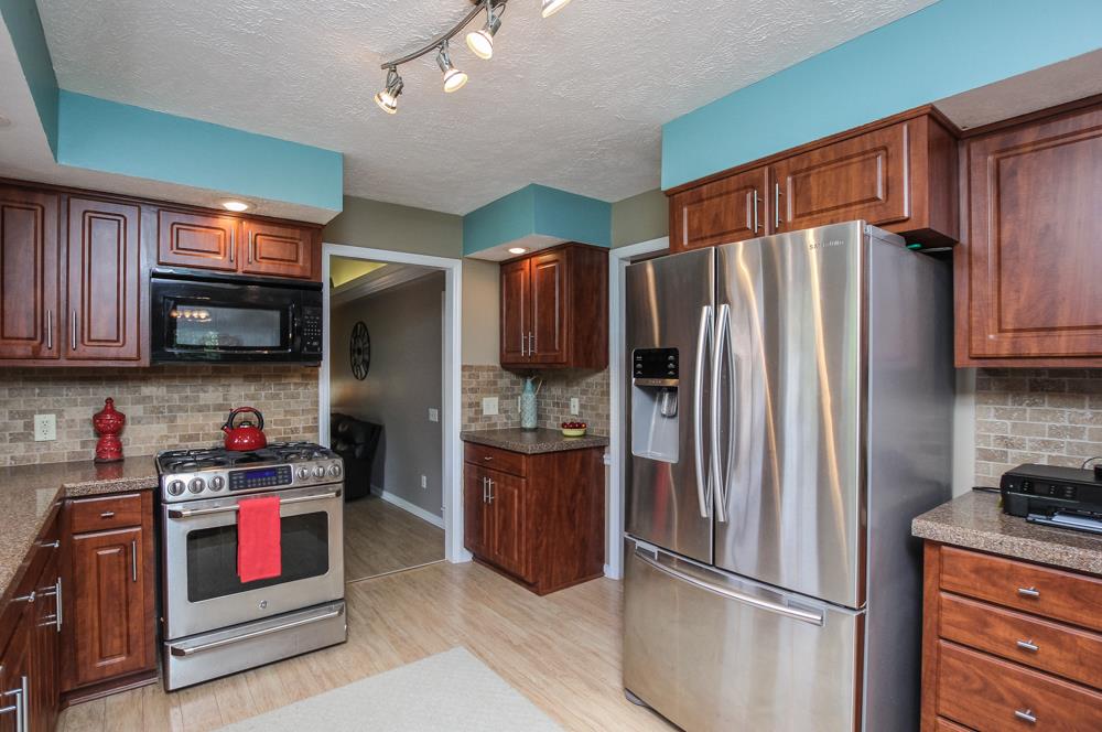 496 Horn Springs Road Lebanon, TN 37087 - Photo 15 of 30 a kitchen with stainless steel appliances granite countertop a refrigerator stove and oven