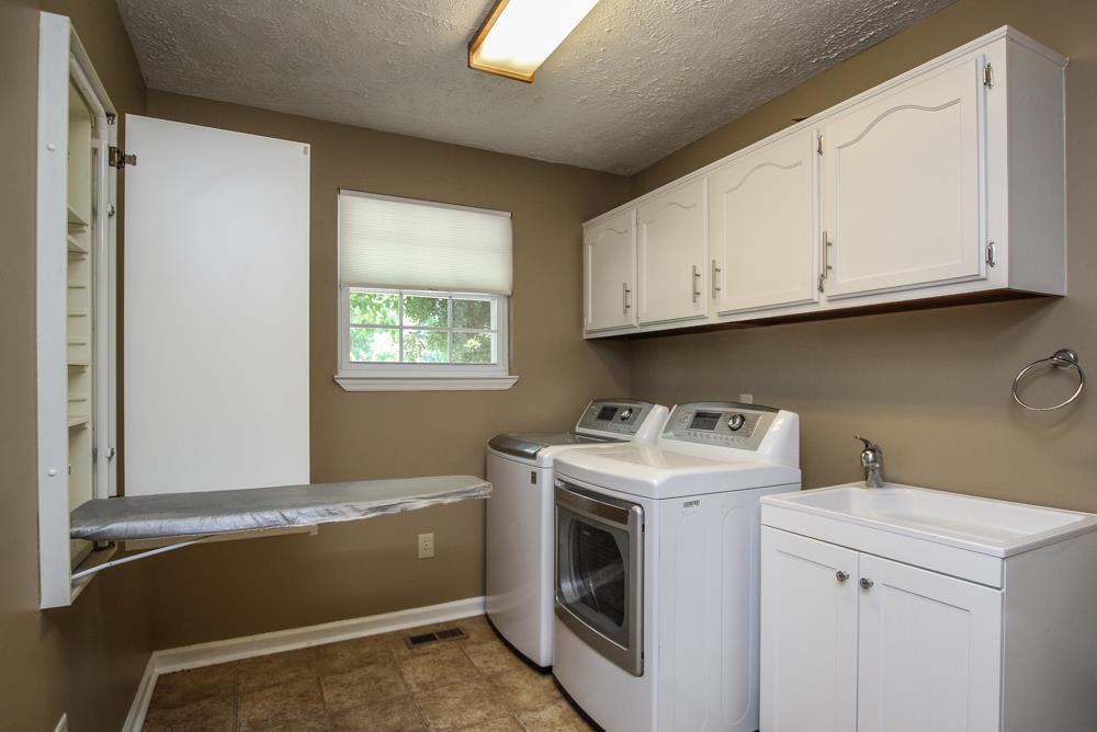 496 Horn Springs Road Lebanon, TN 37087 - Photo 17 of 30 a utility room with sink dryer and washer