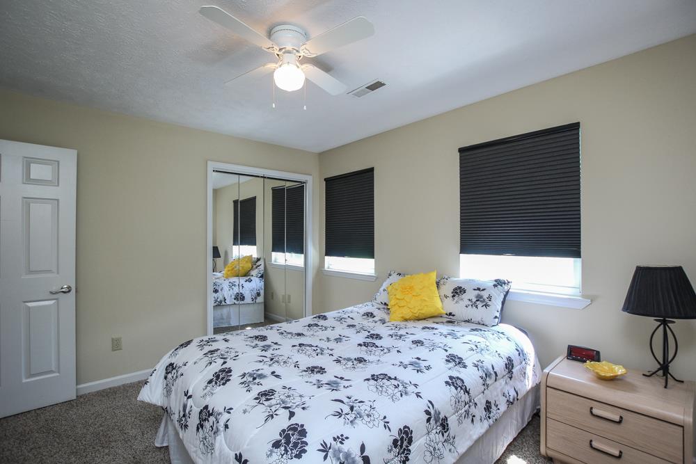 496 Horn Springs Road Lebanon, TN 37087 - Photo 22 of 30 a bedroom with a bed and wooden floor